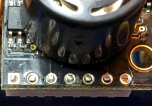 edge of completed part with header and sensor on board